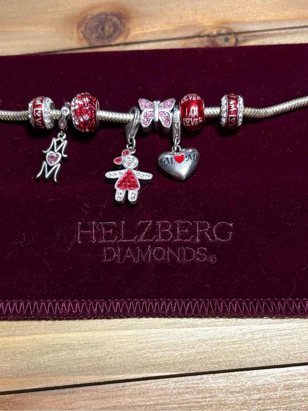 Helzberg Diamonds Silver Bracelet with Red and Pink Charms